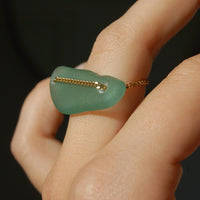 Upcycled ring in polished glass and gold-plated chain 