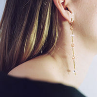 Upcycled dangling earrings adorned with crystals