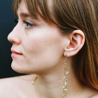 Upcycled dangling earrings adorned with crystals