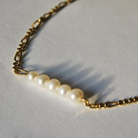 Collier asymétrique upcyclé orné de 5 perles